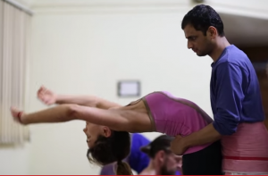 Sharath Jois assisting a student in BackBend.