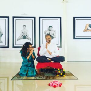 Sharath Jois with yoga student 